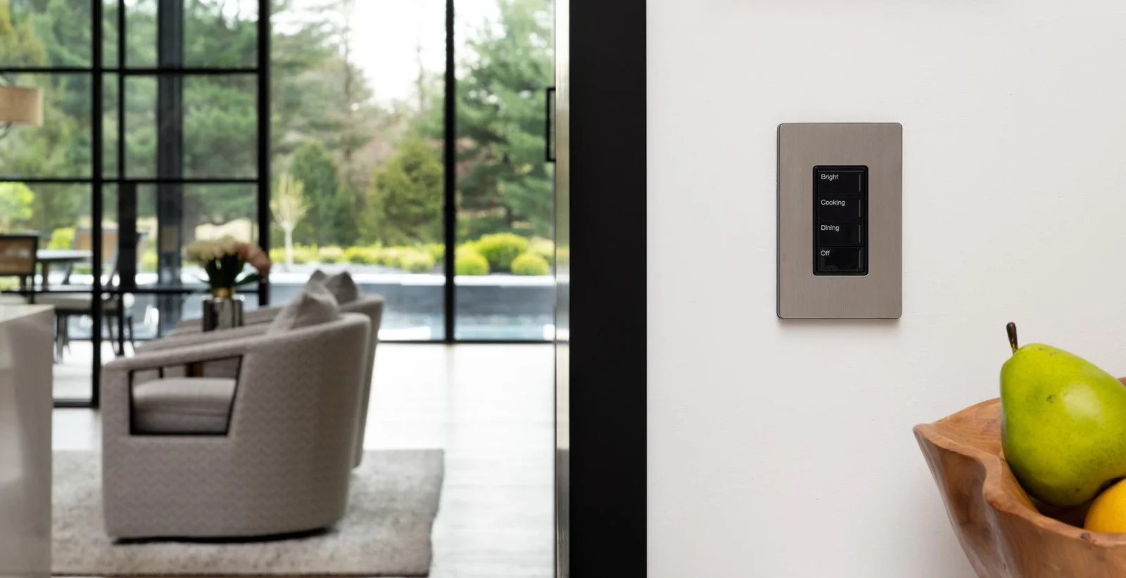 Lutron Sunnata scene keypad beside a bright living room
